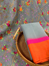 Handmade Grey Banarasi Organza Kora Silk Saree with Orange and Pink Raw Silk Patta on the Border - Floral Embroidery Saree - Kaash