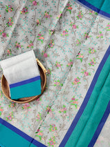 Grey Kora Organza with Blue & Green Patta saree in banarasi kora organza silk with raw silk patta with floral jaal embroidery — Kaash Collection