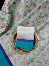Grey Kora Organza with Blue & Green Patta saree in banarasi kora organza silk with raw silk patta with floral jaal embroidery — Kaash Collection