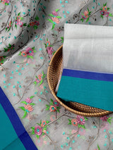Grey Kora Organza with Blue & Green Patta saree in banarasi kora organza silk with raw silk patta with floral jaal embroidery — Kaash Collection