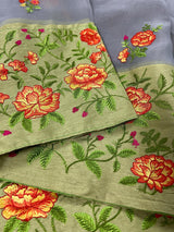 Handmade Light Grey Color Banarasi Kora Organza Saree with Floral Embroidery - Pista Green Raw Silk Border with Floral Embroidery - Kaash
