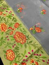 Handmade Light Grey Color Banarasi Kora Organza Saree with Floral Embroidery - Pista Green Raw Silk Border with Floral Embroidery - Kaash
