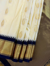 Pastel Cream Color Banarasi Silk Saree with Ganga Yamuna Border in Blue and Pink with Muted Zari Weave and Temple Border