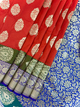 Statement Handmade Burnt Orange Color Banarasi Soft Katan Silk Saree with Floral Buttas with Mehandi Green and Blue Border and Pallu