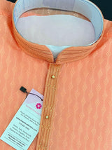 Peach men's kurta pajama in raw silk (non-pure) with self-weave pattern — Kaash Collection