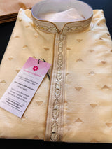Cream men's kurta pajama in raw silk with hand embroidery on neckline & collar — Kaash Collection