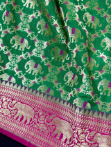 Green & Pink Banarasi saree in banarasi silk with shikargah with elephant & horse motifs — Kaash Collection