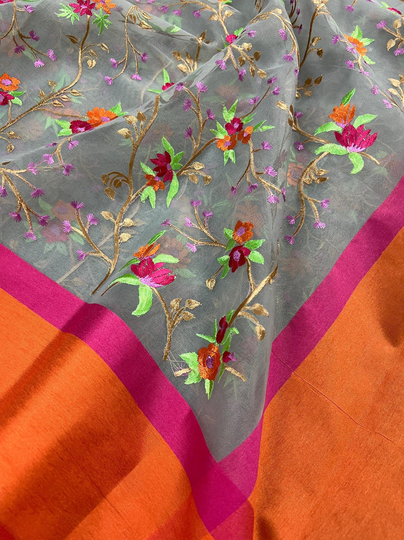 Handmade Grey Banarasi Organza Kora Silk Saree with Orange and Pink Raw Silk Patta on the Border - Floral Embroidery Saree - Kaash