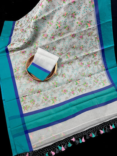 Grey Kora Organza with Blue & Green Patta saree in banarasi kora organza silk with raw silk patta with floral jaal embroidery — Kaash Collection