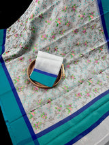 Grey Kora Organza with Blue & Green Patta saree in banarasi kora organza silk with raw silk patta with floral jaal embroidery — Kaash Collection