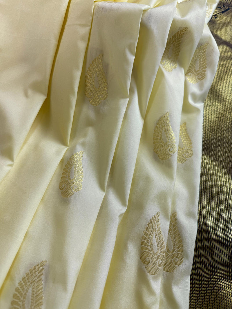Pastel Cream Color Banarasi Silk Saree with Ganga Yamuna Border in Blue and Pink with Muted Zari Weave and Temple Border