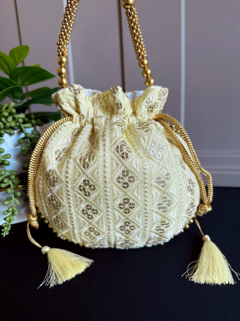 Pastel Yellow Color Raw Silk Light Weight Potli Bag - Kaash